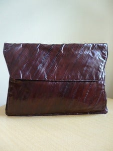 Image of dark brown eelskin envelope clutch