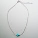 Image of Sideways Turquoise Howlite Cross Necklace