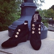 Image of button wedge shoe..