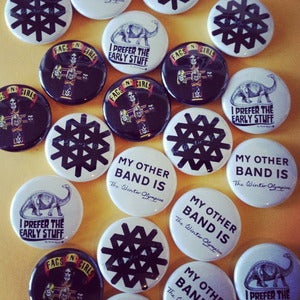Image of FOUR BADGES - A Bag of Buttons, a Packet of Pins. Four Badges.