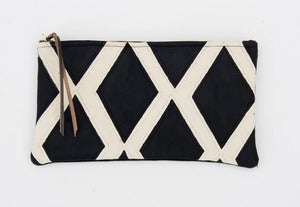 Image of a large black + white hand painted diamonds zip clutch with a METAL zipper
