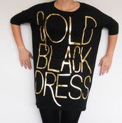 Image of gold black dress