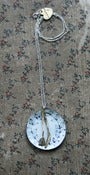 Image of knife and fork on an enamel plate necklace