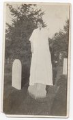 Image of WOMAN IN WHITE FLOATS IN A CEMETERY VINTAGE SNAPSHOT PHOTO 