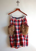 Image of mercibeaucoup pants skirt with a pair of fur gloves