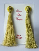 Image of Long tassel Breakfast at Tiffanys earplugs in silver or gold lurex