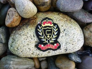 Image of Vintage College Emblem Blazer Patch in Black Felt with Gold / Silver / Red and Black embroidery.