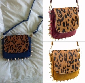 Image of Blue, Yellow, or Red satchel with leopard & spikes