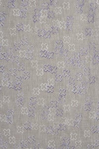 Image of cross dotty orchid and white linen