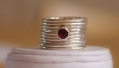 Image of Set of 10 sterling silver stack/stackable rings with natural rich red faceted garnet cabochon