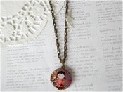 Image of Antique Brass Japanese Girl Locket with White Bird 