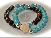 Image of Buddha in turquoise and tiger's eye