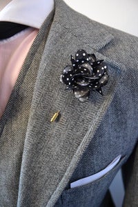 Image of white dot lapel flower
