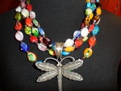 Image of N1228 Four strands of multi colored glass beads 
