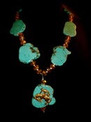 Image of N1099 Lt. Topaz with slab magnesite with pendant