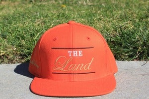 Image of The Land ( Orange Snapback )