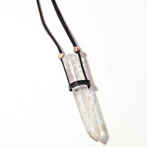 Image of large quartz crystal & brass bead on leather necklace
