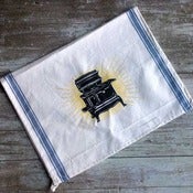 Image of The Brilliant Stove tea towel