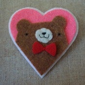 Image of brown pudgy bear + bowtie heart 