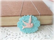 Image of Pink Swallow in Blue Frame Necklace