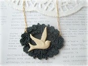 Image of Cream Swallow in Black Frame Necklace