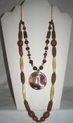 Image of Wood Beads Multi Strand Necklace with Shell Pendant Essence of Earth