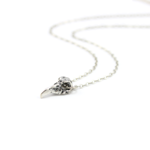 Image of Merla. Tiny Raven Skull Necklace
