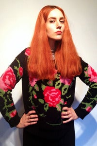 Image of knitted black bed of roses jumper