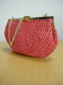 Image of red raffia straw handbag