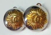 Image of Chanel Two Tone Starburst Logo Clip Earrings