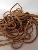 Image of supplies- 2 dozen skinny tan elastic headbands